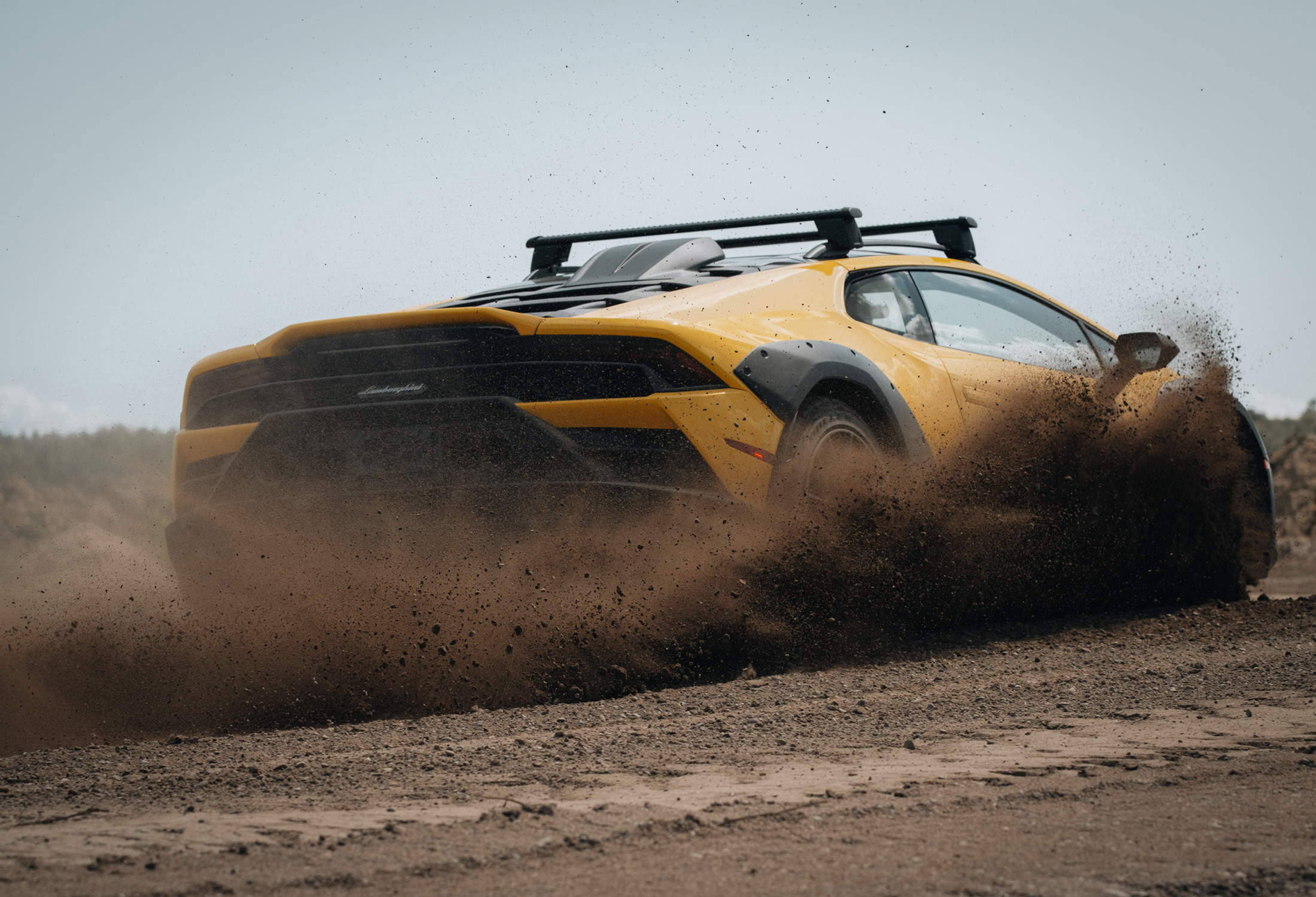 Lamborghini Huracán Sterrato launching through dirt
